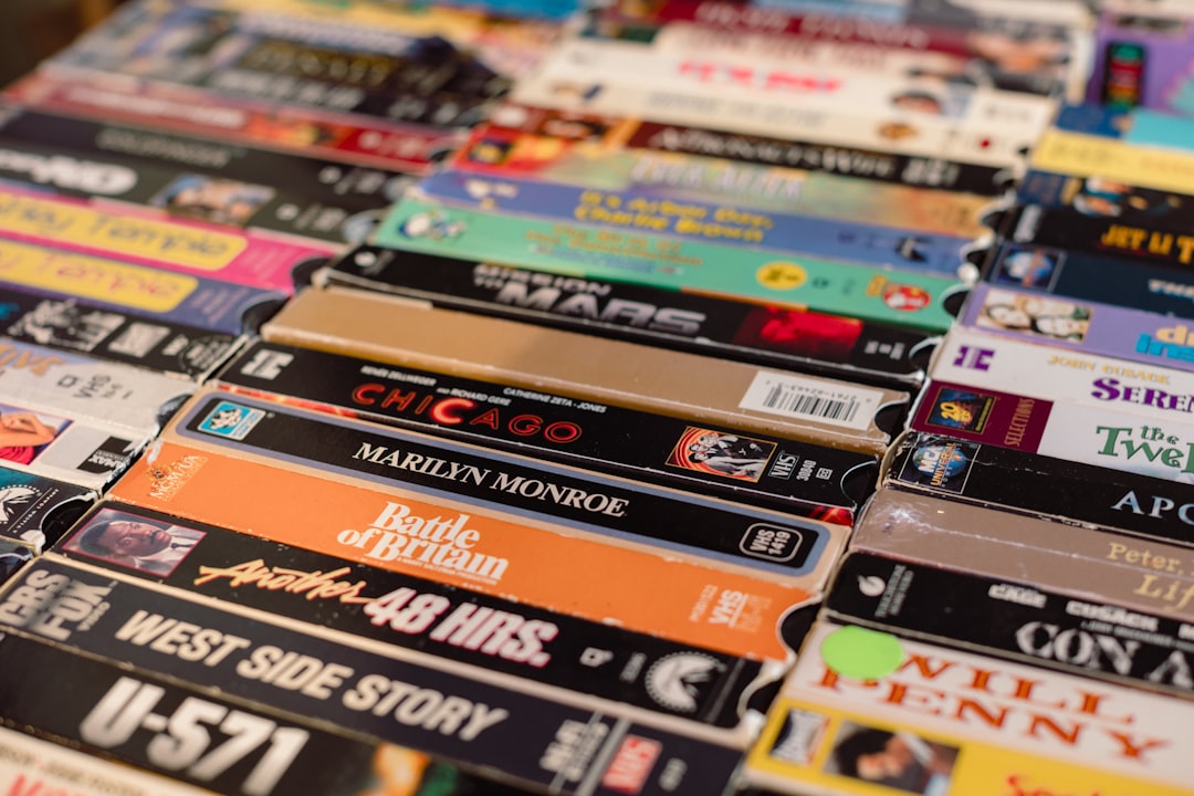 a-bunch-of-different-types-of-dvds-on-a-table-deaj1-iyaeg